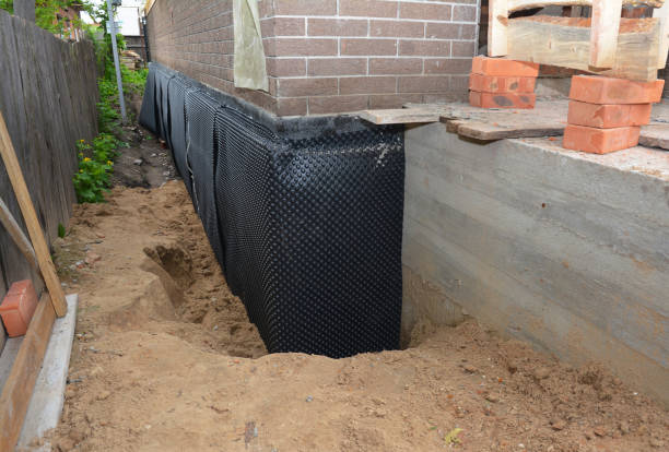 SJ Waterproofing Pros technician performing targeted Emergency Waterproofing assessment in Harrison, NY
